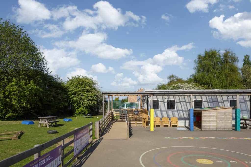 Playground. Ramp with accessibility for wheelchairs up to the temporary classrooms.